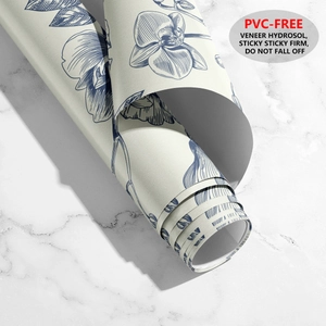 Detail of blue floral self-adhesive wallpaper roll with strong hydrosol backing