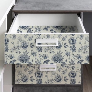 Blue floral self-adhesive wallpaper applied to modern drawer fronts and interiors