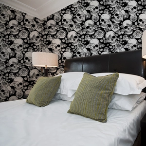 Dark gothic wallpaper with skull and rose patterns for Halloween bedroom wall decor