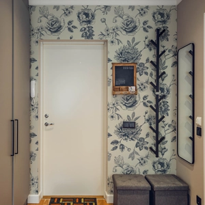 Blue vintage floral wallpaper with peony patterns in a modern entryway setting