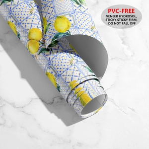 Detail of PVC-free self-adhesive wallpaper with lemon and blue tile patterns
