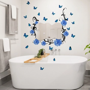 Blue floral vine and butterfly wall stickers applied on modern bathroom tiles and bathtub