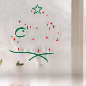 Detail of Christmas tree window sticker with Merry Christmas text and star pattern