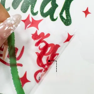Macro view of double-sided Christmas window stickers with colorful festive patterns
