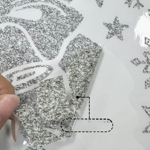 Detail showing the double-sided colorful glitter reindeer and snowflake window stickers