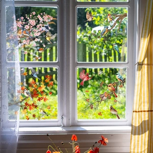 Seasonal bird and floral window stickers set featuring spring, summer, autumn, and winter