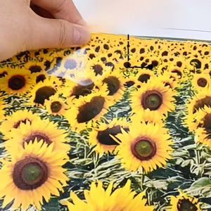 Detail showing self-adhesive sunflower wall sticker applied on a neutral colored surface