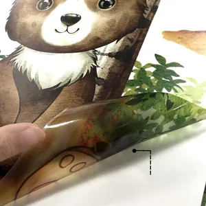Detail showing self-adhesive backing being peeled off from green tree wall sticker