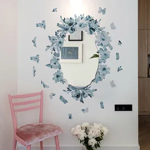 Creative blue watercolor flower and butterfly wall stickers decorating a round mirror