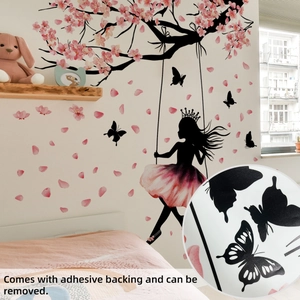 Detail of pink cherry blossom wall decal with girl on swing and removable adhesive texture