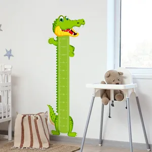 Detailed view of cartoon crocodile height chart sticker with 10-120cm scale on white wall