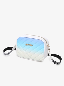 Detail of the blue to white gradient crossbody bag with V-shaped quilting and golden plate