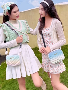 Close-up of rainbow gradient quilted crossbody bags with stylish wide canvas straps