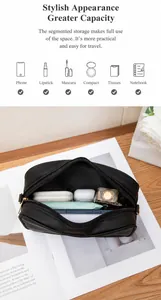 Detailoverzicht van de binnenkant van de tas met vakken voor telefoon en cosmetica