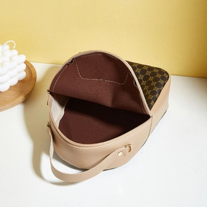 Fashionable beige and brown crossbody bag with geometric print and gold metal zipper detail