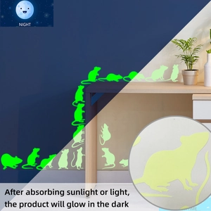 Glow-in-the-dark mouse wall stickers showing daylight vs bright green night luminescence