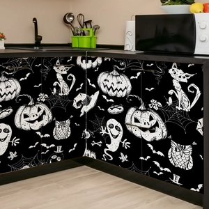 Pegatina de pared de Halloween en blanco y negro con calabazas en un armario de cocina