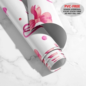 Détail du rouleau de papier peint à nœuds roses et pois, matériau sain sans PVC
