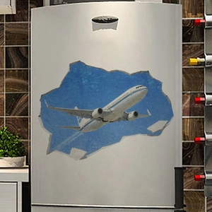 Detailed 3D aircraft wall sticker with broken wall effect on a silver refrigerator