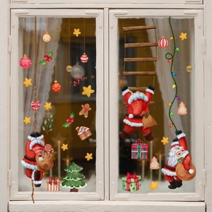 Festive Christmas window decals featuring Santa Claus, reindeer, and tree on glass window