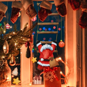 Christmas Santa Claus climbing wooden ladder with gift bag for home window holiday decor