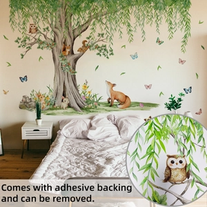 Detail of forest tree wall stickers with cute owls and foxes in kids bedroom decor