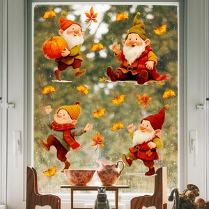 Detail of autumn gnomes and maple leaves static window stickers on glass surface
