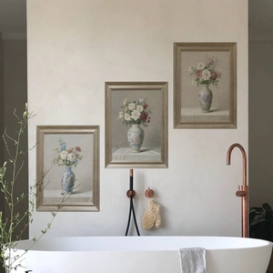 Three-piece floral vase wall art set displayed on a minimalist bathroom wall