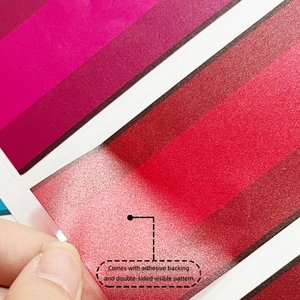 Detail showing red translucent floral wall sticker with frosted texture and adhesive backing