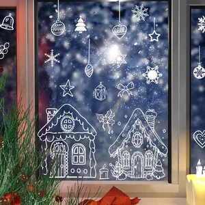 Festive white line Christmas window stickers featuring gingerbread houses and snowflakes