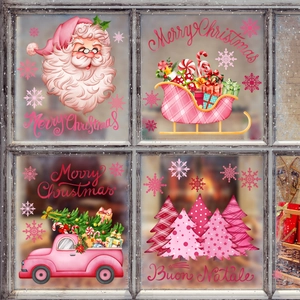 Pink Christmas window stickers set featuring Santa, sleigh, and truck on window glass