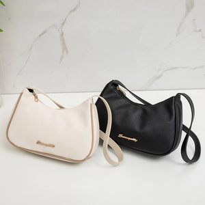 Minimalist hobo bags in cream and black lychee grain leather with gold metal logo accents