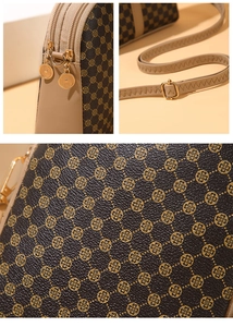Detail of dual zipper hardware and brown PU leather with golden clover print pattern