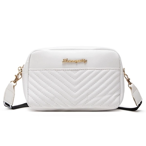 White leather crossbody bag with V-quilted stitching and striped shoulder strap