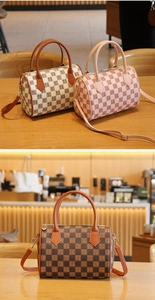Macro detail of Boston style checkerboard bag with letter prints and premium PU handles