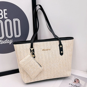 Straw woven tote bag with leather straps and matching coin purse in herringbone pattern