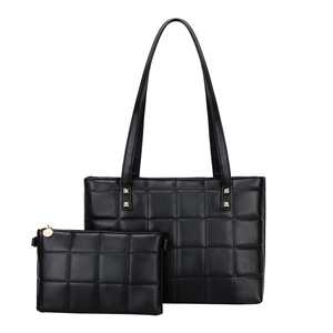 Chic black quilted faux leather tote bag with matching small pouch and metal rivets