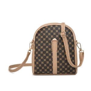 Women's small semi-circular crossbody bag with brown floral print and golden hardware