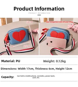 Blue lychee pattern crossbody bag with red heart patch and striped strap details
