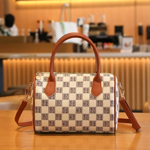 Checkboard letter print Boston handbag with brown leather handles and wide shoulder strap
