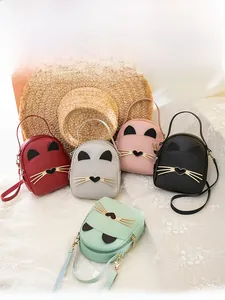 Detail view of mini cat-ear backpacks in various colors with metallic whisker accents