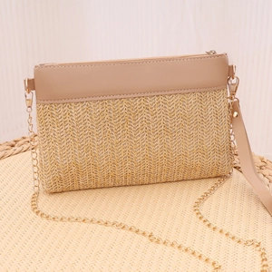 Fashionable woven straw crossbody bag with gold chain strap and leather wristband