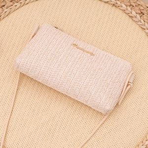 Chic beige woven straw mini crossbody bag with gold logo and chain for summer