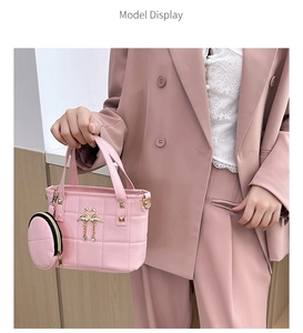 Pink quilted handbag with matching round coin purse charm and gold swan metal buckle