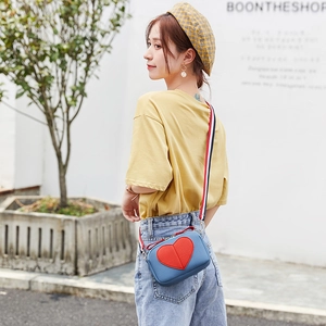 Royal blue lychee texture crossbody bag with red heart and colorful striped strap
