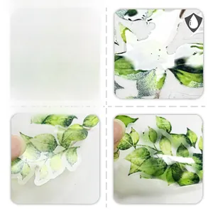Close-up of waterproof green leaf wall stickers showing double-sided texture and PVC detail