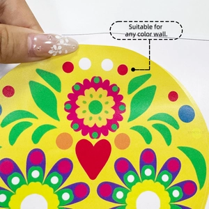 Detail of colorful folk style floral wall sticker with red heart and yellow background