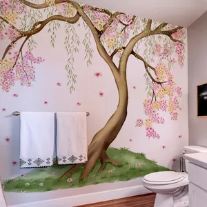 Détail d'un sticker mural grand cerisier rose en fleurs dans une salle de bain chic
