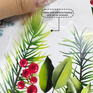 Detail of self-adhesive Christmas floral wall decal showing easy peel-off PET material