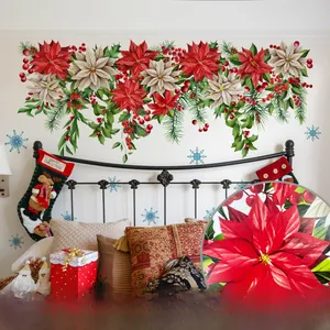 Macro view of Christmas floral wall stickers with holly berries and snowflakes
